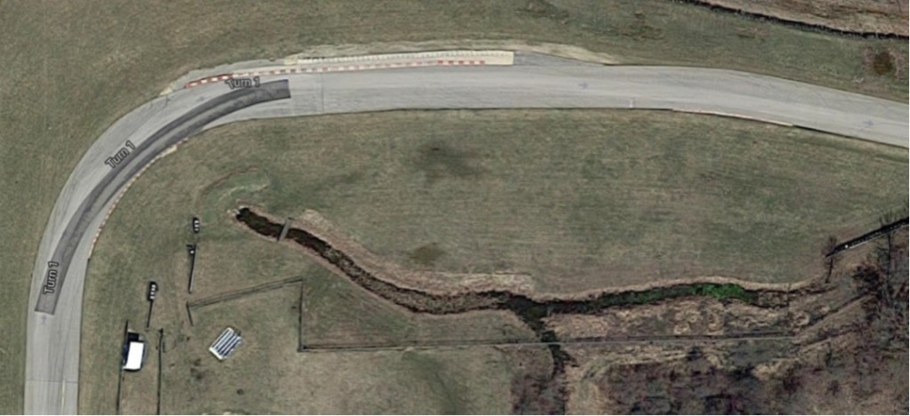 This image has an empty alt attribute; its file name is TrackMap-Turn-1-1024x468.jpg